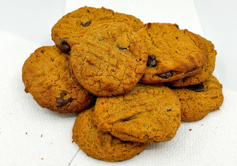 Flourless peanut butter and honey cookies on white surface