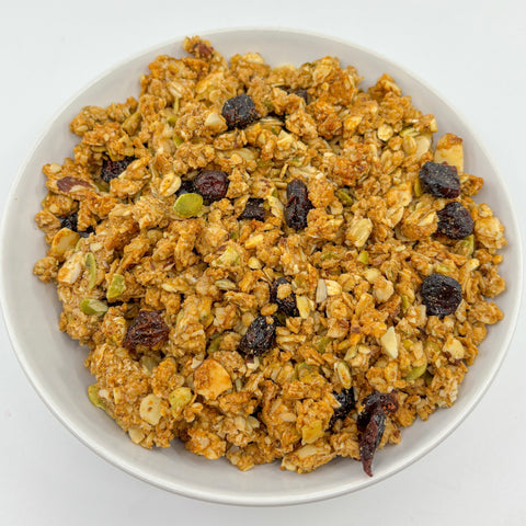 Honey Granola in white bowl on white surface