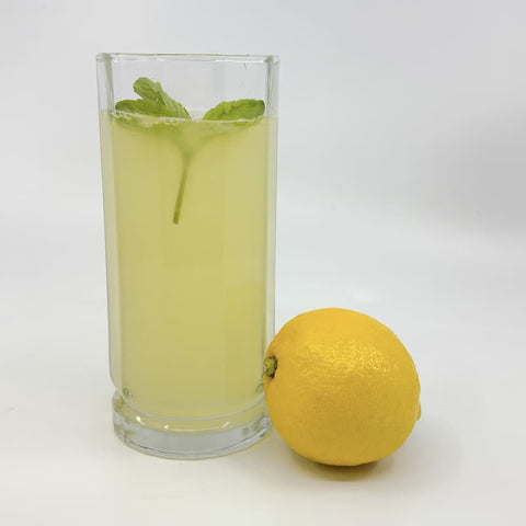 Glass of honey lemonade served over ice