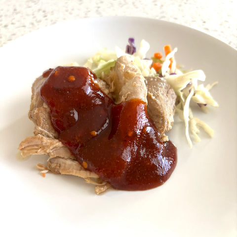 Close-up of hot honey BBQ sauce on grilled meat