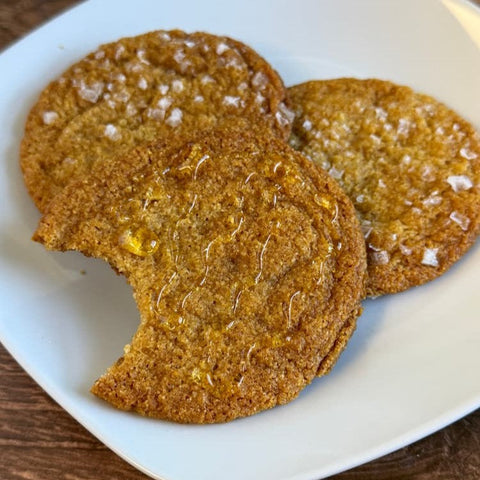 Cookies on a white plate on a wooden surface