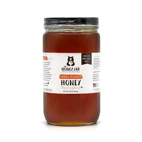 A jar of California Orange Blossom Honey on a White Background by The Honey Jar