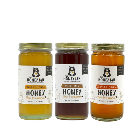 Three jars of honey from The Honey Jar on a white background