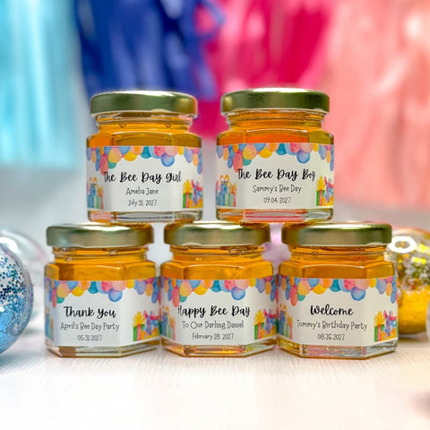 Five jars of honey with personalized labels on a colorful background