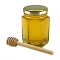 6 oz honey favor with gold lid and 4" honey dipper.