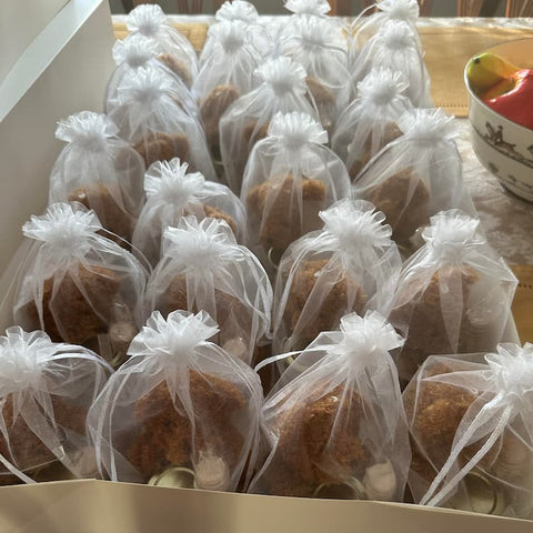 Multiple sheer bags, each filled with a plush bear and a jar of honey.