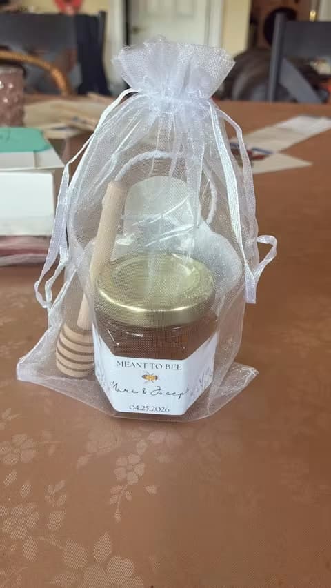 Sheer bag with jar of honey and dipper