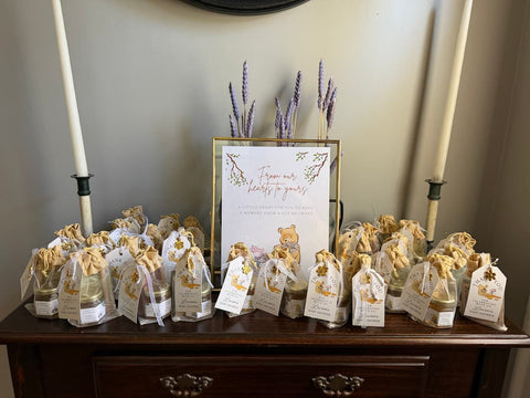 Favor table with gift bags and a sign