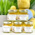 2 oz honey favors with gold lids and personalized labels showing Winnie the Pooh, Piglet, Tigger, and Kanga. Personalized label options include Thank You BEARY Much, Thanks for Coming, A Little Hunny is on the Way, A Little Yummy for Your Tummy, and Smoetimes the smallest things take up the most room in your heart.