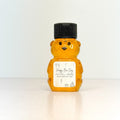 Honey bear bottle with a personalized label on a white background