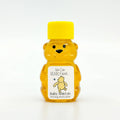 2 oz Winnie the Pooh honey bear baby shower favor with yellow cap and personalized label. Label shows classic Winnie the Pooh chasing a butterfly with the title We Can Bearly Wait.