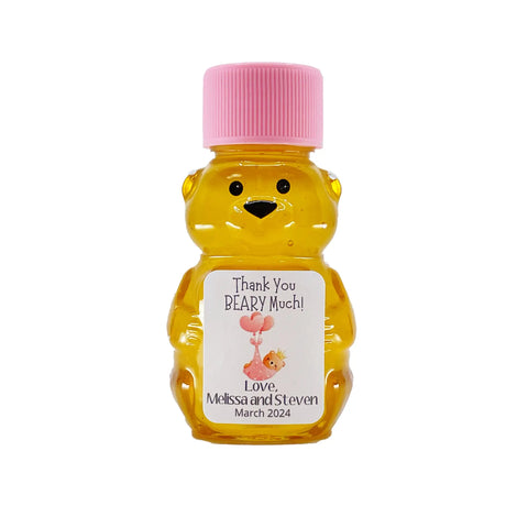 2 oz honey bear baby shower favor with pink cap and personalized label. Label shows a dreaming bear in a pink blanket with the title Thank You Beary Much.