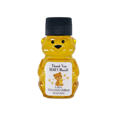 2 oz honey bear baby shower favor with black cap and personalized label. Label shows a honey bear with the title Thank You Beary Much.