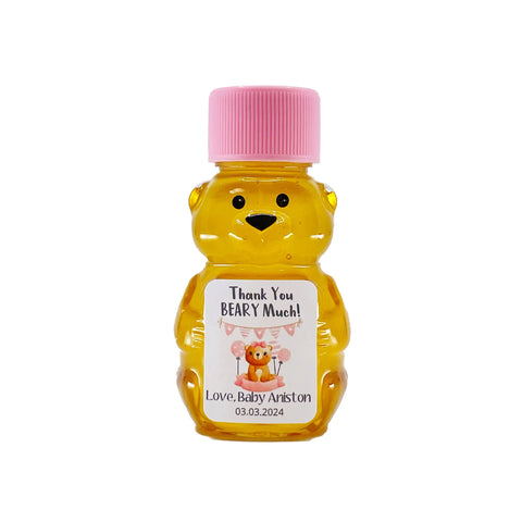 2 oz honey bear baby shower favor with pink cap and personalized label. Label shows a bear with pink party decorations with the title Thank You Beary Much.