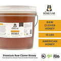 Honey jar with label and 'The Honey Jar' branding on a white background