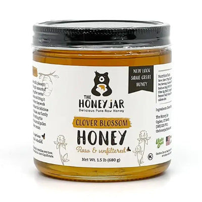Jar of honey with a label on a white background