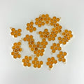 Enamel Honeycomb charms scattered across white background.