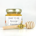 favor set options shown, including honey, personalized wildflower label, bee our guest title, 3" wooden honey dipper, and gold bee charm.