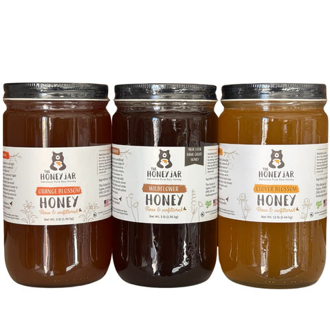 3 jars of honey with The Honey Jar branding on a white background
