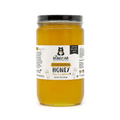 Jar of The Honey Jar brand honey with a label on a white background