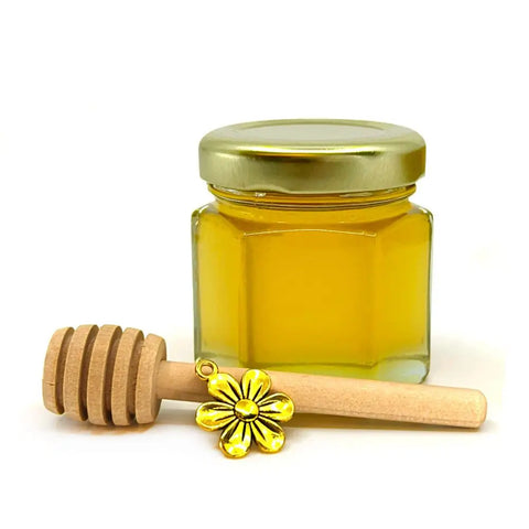 2 oz honey favor with gold lid, 3" wooden honey dipper, and gold colored flower charm.